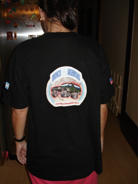 1986 Ford Bronco - T-shirt graphic shows a Ford Bronco, but the photo is of the shirt itself, not the vehicle.