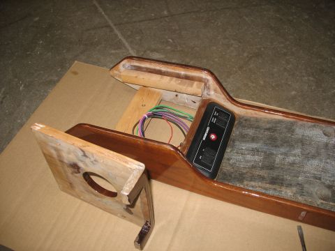 1995 Ford C-350 (Centurion Conversions) - A wooden overhead console part, likely from a vehicle conversion, shows wiring and a control panel with the Centurion brand.