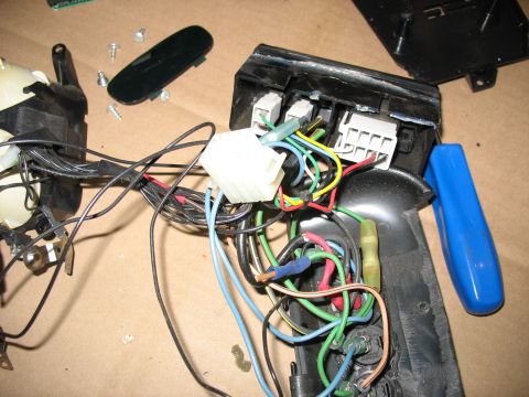 1995 Ford C-350 (Centurion Conversions) - Disassembled overhead console wiring harness showing various connectors and tangled wires.
