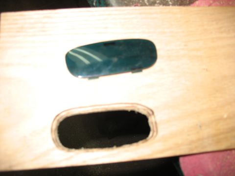 1995 Ford C-350 (Centurion Conversions) - A dark green plastic component is shown above an opening in a wooden surface, likely for an overhead console.