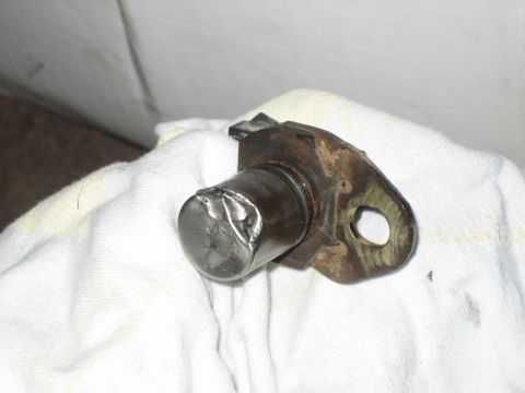 1995 Ford Bronco - A damaged metal component rests on a white cloth, with a Supermotors.net logo visible at the bottom right.