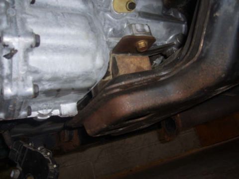 1996 Mercury Grand Marquis - Underside view of vehicle mechanical components, including engine block and exhaust system.
