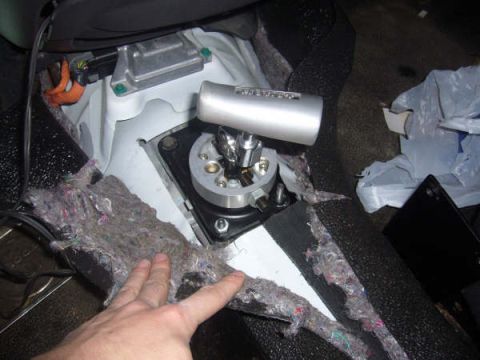1996 Mercury Grand Marquis - The interior of a vehicle shows a new shifter mechanism and surrounding disassembled trim panels.