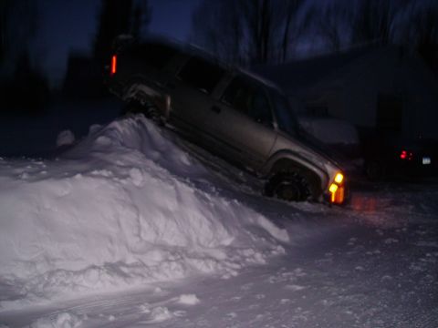 2000 Chevrolet Tahoe - SUV struggling to get traction in deep snow during the night.