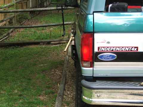 1996 Ford Bronco - Rear view of a teal and silver 1996 Ford Bronco, the Ford emblem and an Independent4x sticker.