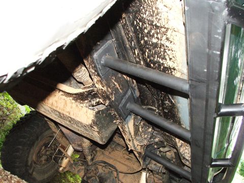 1996 Ford Bronco - Close-up view of the underbody and sliders of a vehicle.