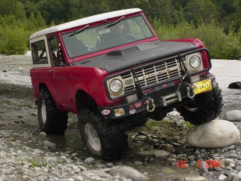 1978 Ford Bronco - This 1978 Ford Bronco navigates a rocky stream bed, demonstrating its off-road capability.