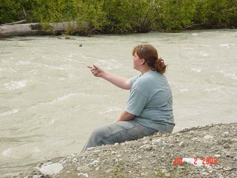 1978 Ford Bronco - A woman sits by a river, with a date stamp of 2005 visible in the lower right corner.