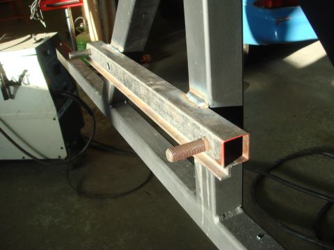 1996 Ford Bronco - Close-up of metal fabrication for a custom rear bumper, showing a threaded rod attached to tubing.