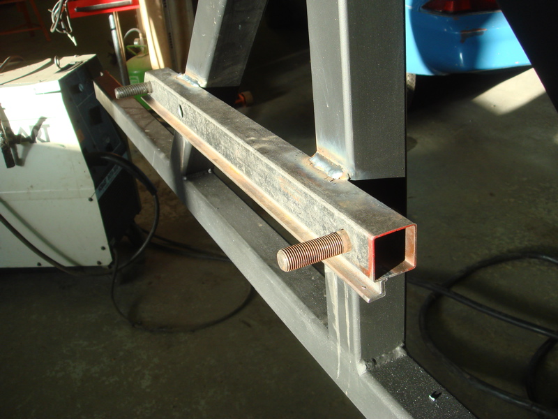 Metal tubing with threaded rod welded to a frame, part of a custom bumper build