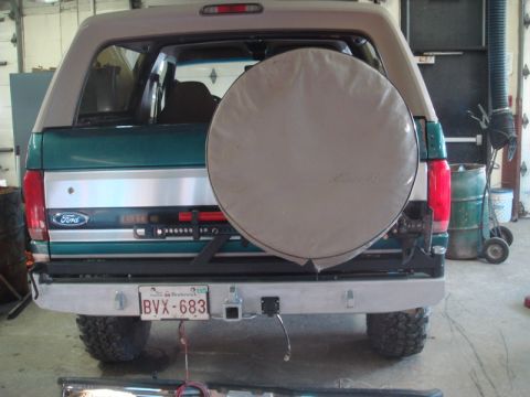 1996 Ford Bronco - Rear view of a 1996 Ford Bronco, showing the spare tire cover and custom bumper.