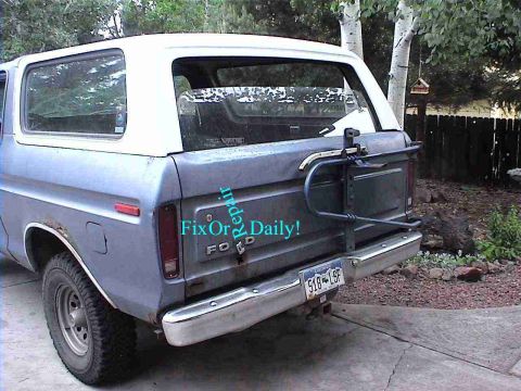1978 Ford Bronco - Rear view of a 1978 Ford Bronco, showing its spare tire carrier and license plate.