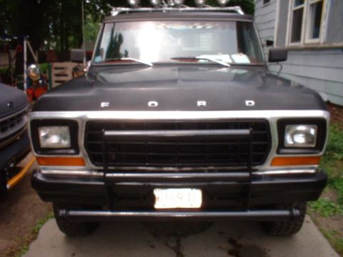 1979 Ford Bronco - This 1979 Ford Bronco features a prominent grille guard and auxiliary lights mounted on the roof rack.