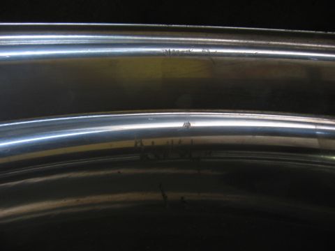 1974 Ford F-100 - Close-up of chrome trim with visible imperfections and wear.