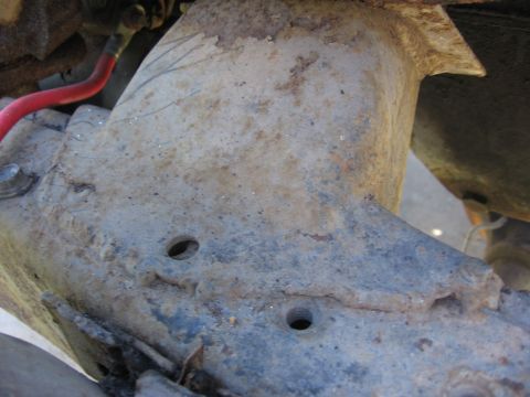 1974 Ford F-100 - This photo shows a heavily rusted section of a truck frame, not a complete vehicle.
