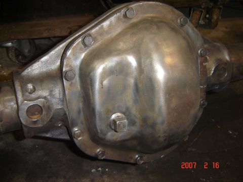 1993 Ford Bronco - A close-up view of a metal differential housing, likely undergoing restoration or repair.