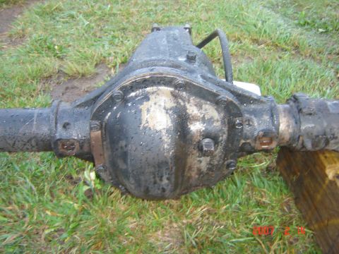 1993 Ford Bronco - Rear axle differential assembly shown outdoors on grass.