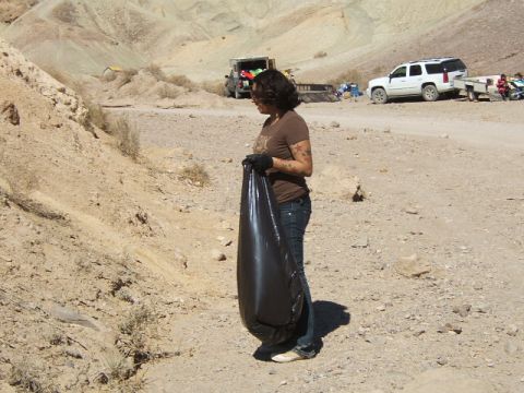 1988 Ford Bronco - Desert cleanup effort with multiple vehicles present.