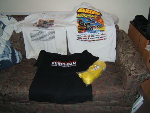 1988 Ford Bronco - Several t-shirts and a yellow strap are displayed on a couch.