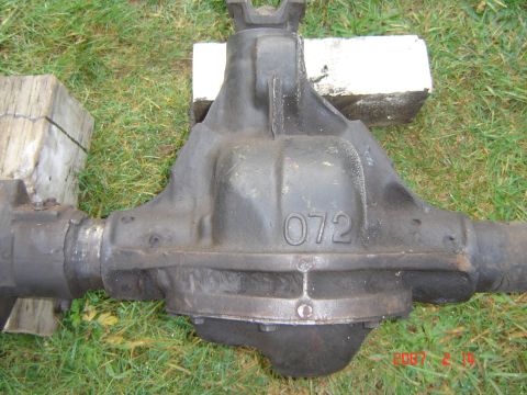 1993 Ford Bronco - This is a rear differential assembly, possibly from a truck or SUV, resting on a grassy surface.