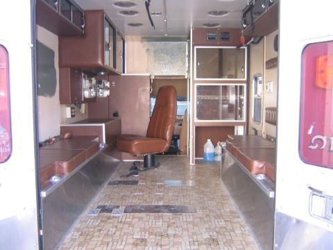 1984 Ford F-350 - The interior of this vehicle shows benches, cabinets, and a driver's seat, but no clear year identification.