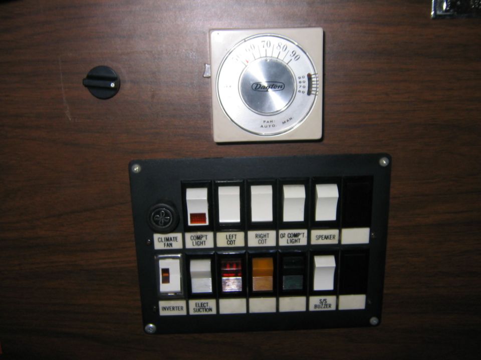 Interior control panel with climate fan, lights, and speaker switches