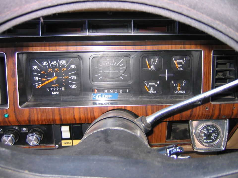 1984 Ford F-350 interior dashboard with wood grain trim and gauges