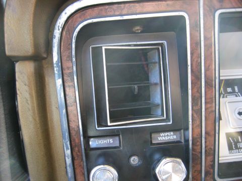 1979 Ford Bronco - Close-up of the dashboard interior of a 1979 Ford Bronco, highlighting the air vent and control buttons.
