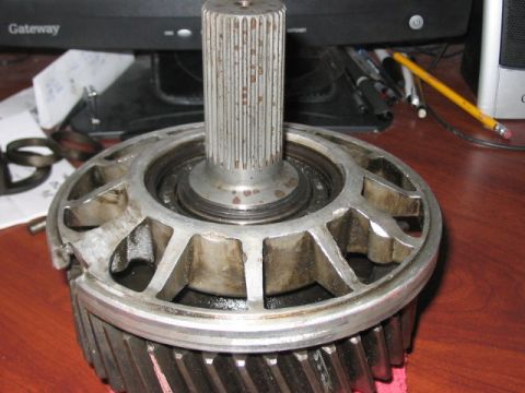 1991 Ford Bronco - This image shows a mechanical part, possibly a gear and shaft assembly, resting on a desk.