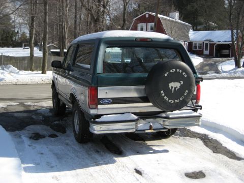 1994 Ford Bronco - Rear view of a 1994 Ford Bronco parked in the snow.