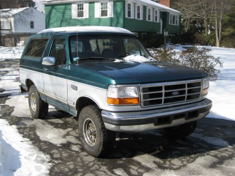 1994 Ford Bronco - This 1994 Ford Bronco features a two-tone green and white paint scheme and is seen here in a snowy environment.