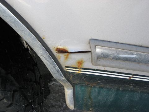 1994 Ford Bronco - Rust is visible on the fender of this 1994 Ford Bronco, near the wheel well and trim.