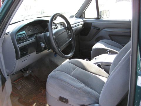 1994 Ford Bronco - Interior view of a 1992 Ford Bronco XLT, showing the dashboard, steering wheel, and front seats.