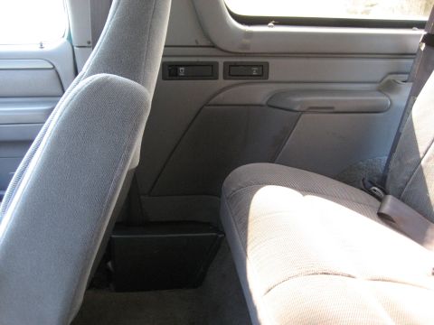 1994 Ford Bronco - Interior view of a 1994 Ford Bronco, highlighting the seats and door panel details.