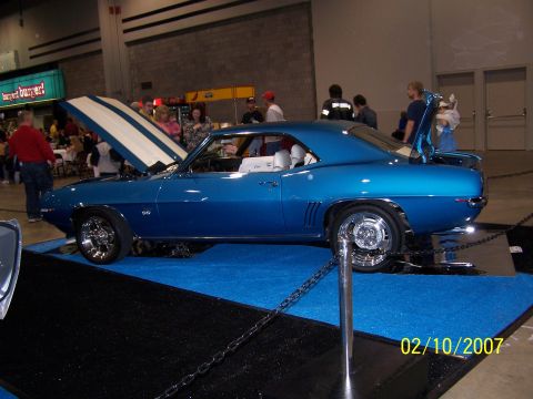 1979 Ford F-150 - This blue 1969 Chevrolet Camaro SS is displayed indoors with its hood and trunk open.