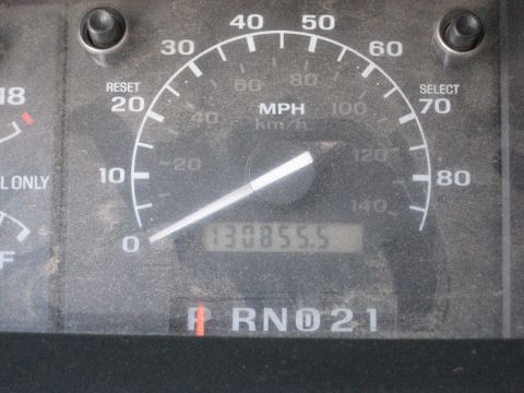 1994 Ford Bronco - Odometer displays 130,855.5 miles on a dusty dashboard with gear selection indicators.