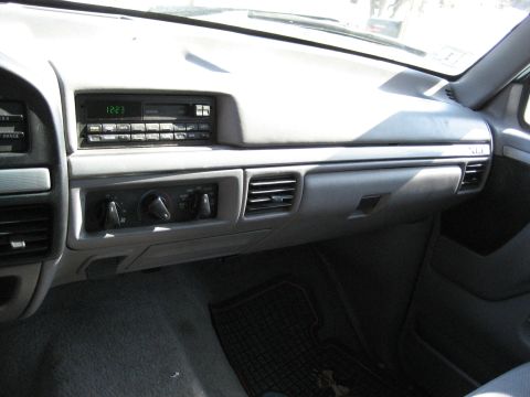 1994 Ford Bronco - Interior view of a 1994 Ford Bronco, showing the dashboard with radio and climate controls.