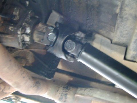 1979 Ford Bronco - Underside view of a vehicle's driveshaft and U-joint.