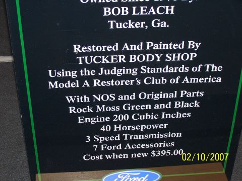 1979 Ford F-150 - Sign details restoration of a truck owned by Bob Leach, listing engine specs, cost when new, and restoration by Tucker Body Shop.