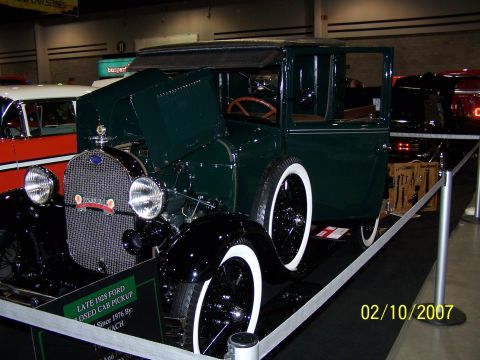 1979 Ford F-150 - This 1928 Ford Model A pickup is displayed with its hood open and a set of tools nearby.