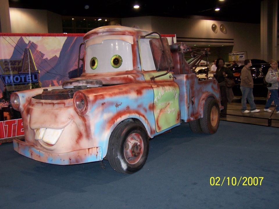 Mater tow truck replica with cartoon eyes and buck teeth