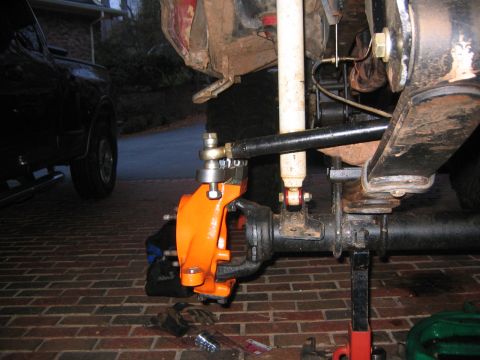 1979 Ford Bronco - Close-up view of a vehicle's front axle and suspension components during a rebuild.