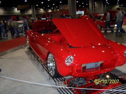 1979 Ford F-150 - A bright red convertible is displayed with its hood open at an indoor event, showing a date stamp of 02/10/2007.