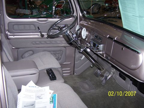 1979 Ford F-150 - The interior of a classic Ford truck shows custom upholstery and a modified dashboard.