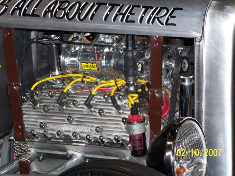 1979 Ford F-150 - A custom V8 engine with chrome accents and yellow spark plug wires is shown in detail.