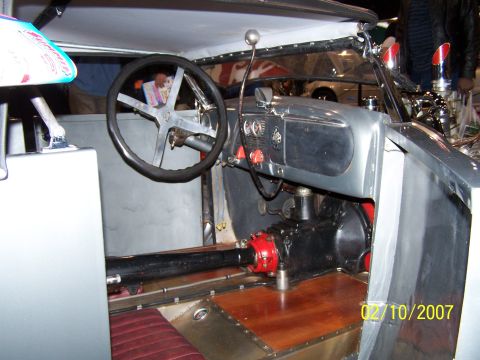 1979 Ford F-150 - The interior of a custom vehicle shows a unique dashboard and transmission tunnel.