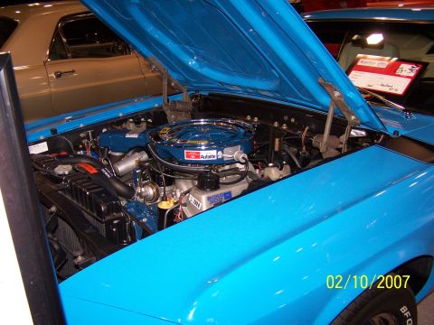 1979 Ford F-150 - Close-up of a blue car's engine compartment, a Ford Boss 302 engine and a date stamp of 02/10/2007.