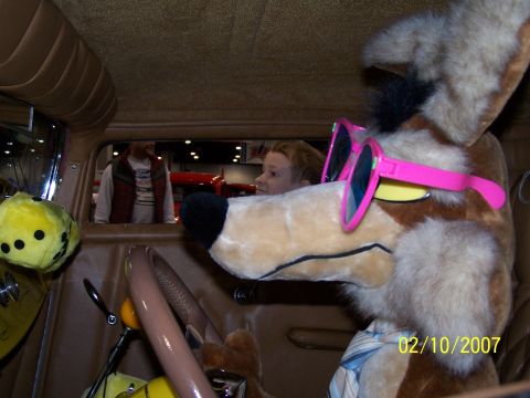 1979 Ford F-150 - A stuffed coyote mascot with pink sunglasses and a tie sits behind the wheel of a vehicle, with a date stamp of 02/10/2007 visible.