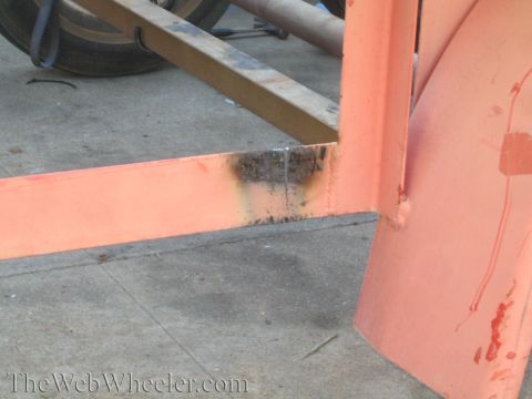 1987 Suzuki Samurai - The trailer frame shows signs of rust and repair work, with a tire visible in the background.