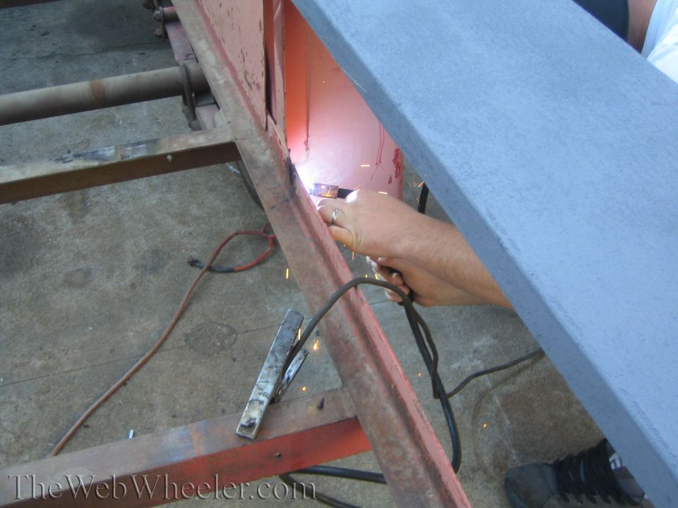 welding sparks flying on a rusty metal frame